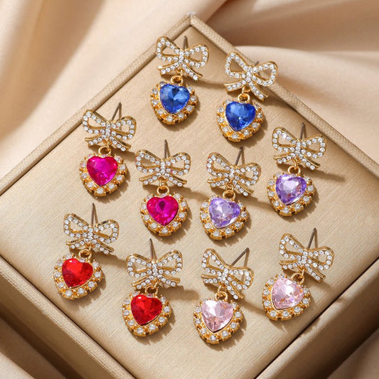 Zinc Alloy Bow Heart Shape With Diamond Earrings $9.84 Dana Fashion Color: Blue Loving Heart Women's Accessories Product information: Color: blue loving heart, pink love, Red Love, purple love, Rose Red Love Material: zinc alloy Shape: heart-shaped, Bow P