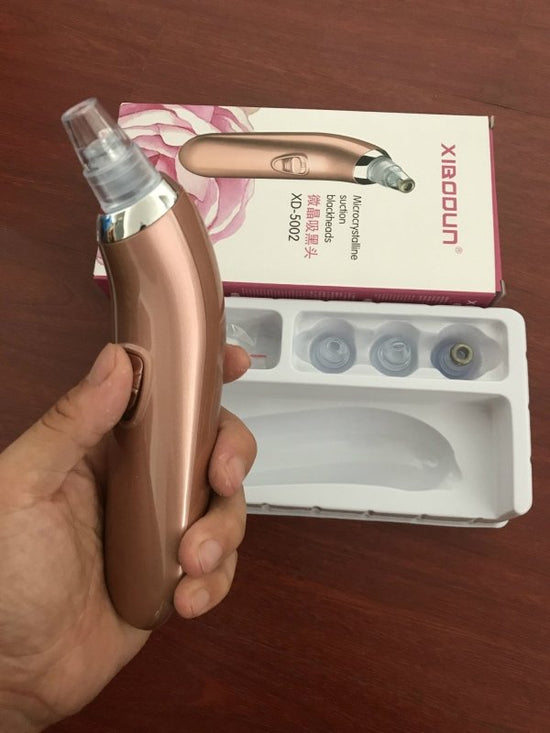 Acne remover household Pore Cleaner $39.99 Dana Fashion Color: Pink Size: Four heads Beauty Tools Product Name: microcrystalline black head instrument Products include: main engine, 4 suction heads, 1 manual, sealing ring, cleaning cotton Product model: x
