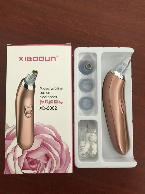 Acne remover household Pore Cleaner $39.99 Dana Fashion Color: Pink Size: Four heads Beauty Tools Product Name: microcrystalline black head instrument Products include: main engine, 4 suction heads, 1 manual, sealing ring, cleaning cotton Product model: x