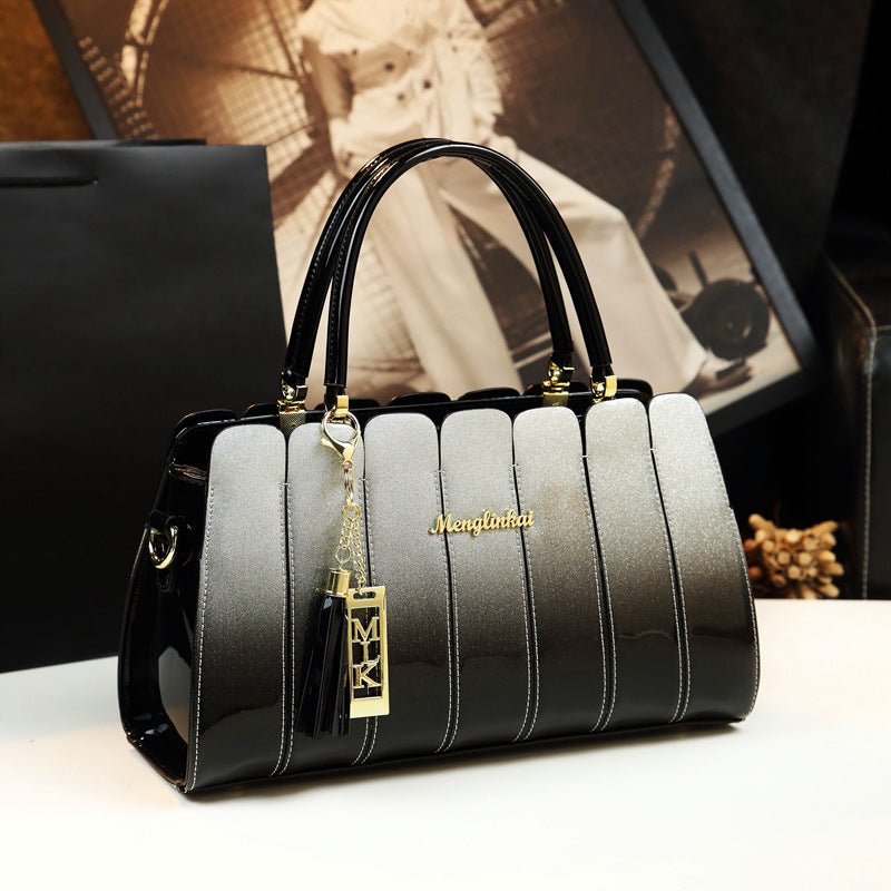All-match handbag $180.99 Dana Fashion Color: Silver gray Women's Bags Leather material: patent leather Product size: 33cm* 13cm* 20cm Inside material: high-density polyester lining Product structure: zipper pocket / compartment inner pocket Style: single