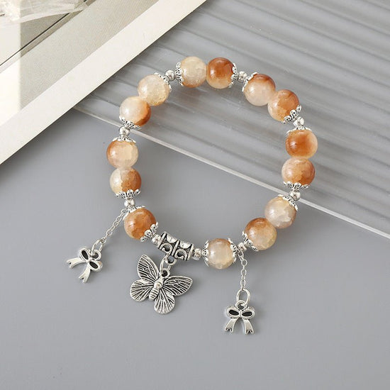 All-matching Graceful Crystal Bracelet For Women $12.00 Dana Fashion Color: K3336 Brown Women's Accessories Product information: Processing Technology: manual Color: K3334 butterfly crack bead bracelet pink, K3335 butterfly crack bead bracelet Blue, K3336
