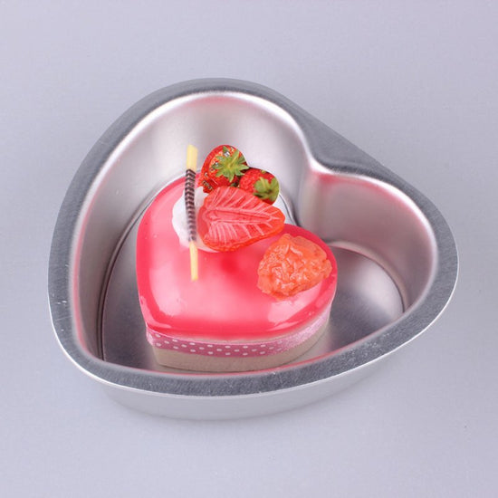 Aluminum Alloy Heart Shaped Live Bottom Cake Mould $34.09 Dana Fashion Color: 10inches Dana's Kitchen Product information: Shape: heart shape Material: aluminum alloy Application: cake mold Size Information: 3 inches - outer diameter 9CM*8CM, depth 2.8CM