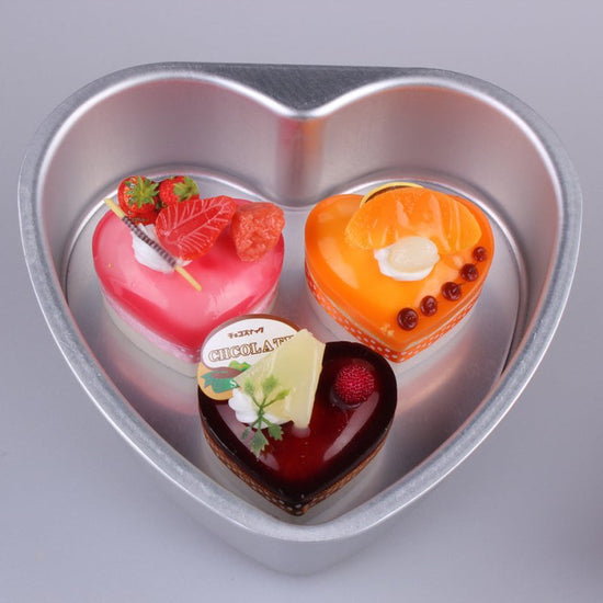 Aluminum Alloy Heart Shaped Live Bottom Cake Mould $34.09 Dana Fashion Color: 10inches Dana's Kitchen Product information: Shape: heart shape Material: aluminum alloy Application: cake mold Size Information: 3 inches - outer diameter 9CM*8CM, depth 2.8CM