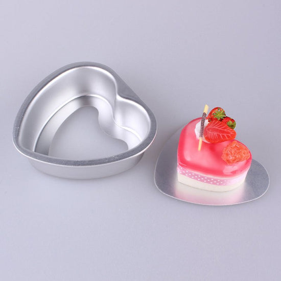 Aluminum Alloy Heart Shaped Live Bottom Cake Mould $34.09 Dana Fashion Color: 10inches Dana's Kitchen Product information: Shape: heart shape Material: aluminum alloy Application: cake mold Size Information: 3 inches - outer diameter 9CM*8CM, depth 2.8CM