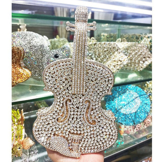 Amazing Luxury Violin Crystal Evening Bags Party Handbag $180.00 Dana Fashion style: Gold Silver Women's Bags Product information: Material: Alloy Closure: Magnetic buckle How to take the bag: hand, shoulder, messenger Applicable scene: banquet Luggage ha