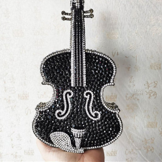 Amazing Luxury Violin Crystal Evening Bags Party Handbag $180.00 Dana Fashion style: A Women's Bags Product information: Material: Alloy Closure: Magnetic buckle How to take the bag: hand, shoulder, messenger Applicable scene: banquet Luggage hardness: ha