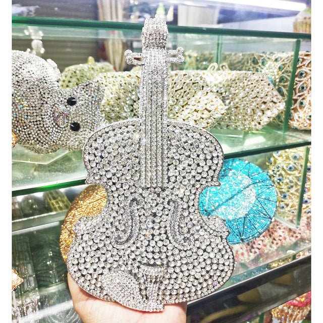 Amazing Luxury Violin Crystal Evening Bags Party Handbag $180.00 Dana Fashion style: Silver Women's Bags Product information: Material: Alloy Closure: Magnetic buckle How to take the bag: hand, shoulder, messenger Applicable scene: banquet Luggage hardnes