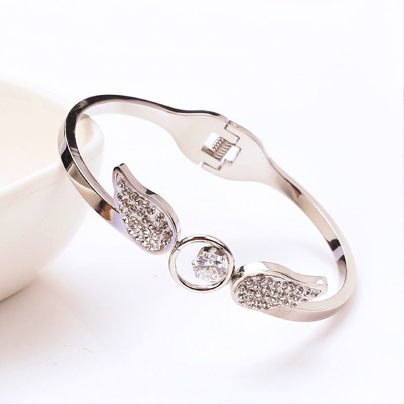 Angel Titanium Steel Hollow Bracelet Zircon Spring Opening $21.43 Dana Fashion Color: Silver Women's Accessories Product information: Treatment Process: zircon Color: silver, gold, rose gold Material: titanium steel Style: Simple Packing list: Bracelet x1