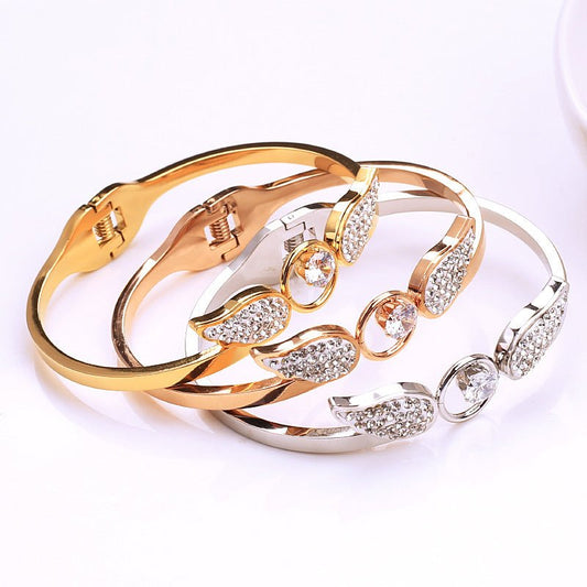 Angel Titanium Steel Hollow Bracelet Zircon Spring Opening $21.43 Dana Fashion Color: Gold Women's Accessories Product information: Treatment Process: zircon Color: silver, gold, rose gold Material: titanium steel Style: Simple Packing list: Bracelet x1 P