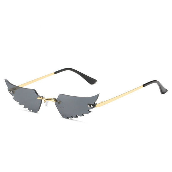 Angel wings sunglasses $19.23 Dana Fashion Color: Gold black Women's Accessories Commodity information: Glasses structure: frame Lens material: PC Style: Personality Frame material: metal UV resistance level: UV400 Model: Irregular feathers