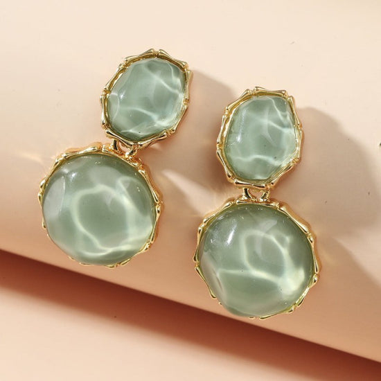 Asymmetric Light Green Creative Water Pattern Irregular Oval Earrings $15.00 Dana Fashion Color: Ivory White Women's Accessories Product information: Treatment Process: Diamond Color: Ivory White, olive green, light yellow, royal blue, pink, rose red, lig