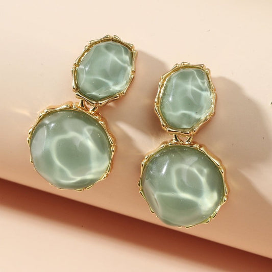 Asymmetric Light Green Creative Water Pattern Irregular Oval Earrings $15.00 Dana Fashion Color: Ivory White Women's Accessories Product information: Treatment Process: Diamond Color: Ivory White, olive green, light yellow, royal blue, pink, rose red, lig