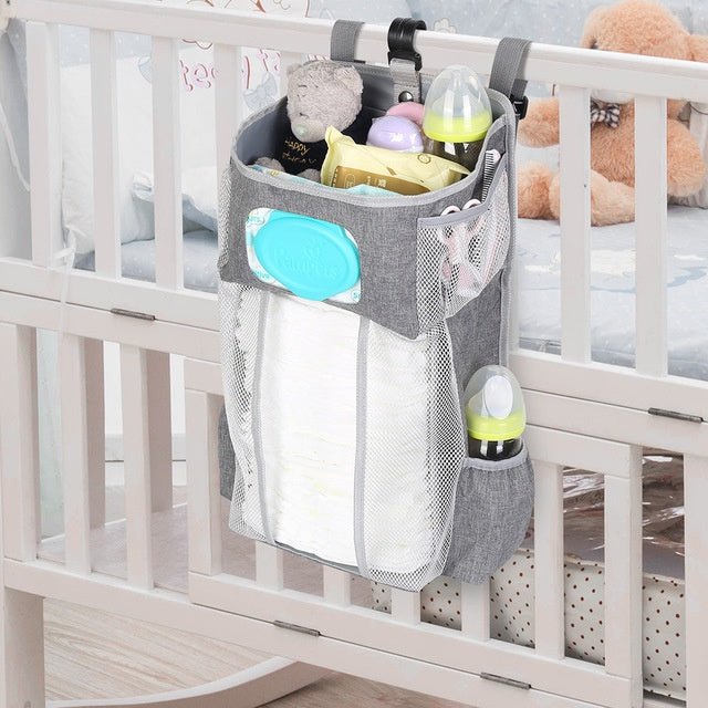 Attachable storage bags $111.79 Dana Fashion Color: Grey Baby & Mother Descriptions: Material: Oxford cloth + PP support plate + diamond mesh Size:44.6*23*16cm（as shown in the follow picture） Packaging:1 Baby crib diaper organizer