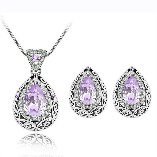 Austria crystal guard water droplet Necklace $29.00 Dana Fashion Color: Light purple Women's Accessories Style: Europe and America Material: Alloy Process: Crystal Style: Women's Set combination: earrings + items Circumference: 21cm (inclusive)-50cm (incl