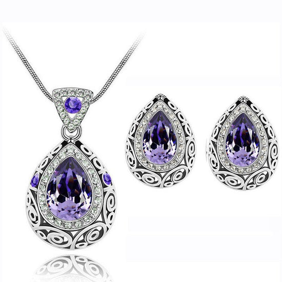 Austria crystal guard water droplet Necklace $29.00 Dana Fashion Color: Purple Women's Accessories Style: Europe and America Material: Alloy Process: Crystal Style: Women's Set combination: earrings + items Circumference: 21cm (inclusive)-50cm (inclusive)