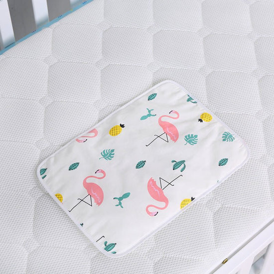 Baby cotton portable diaper changing pad $15.88 Dana Fashion Color: Flamingo Baby & Mother The urine-proof pad is a must-have item for babies to go out. It is easy to carry, and the foldable button can be fixed without loosening. The first layer of pure c