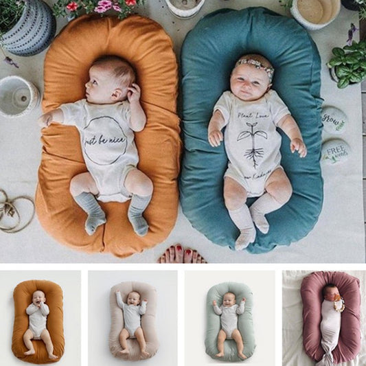 Baby Nest Bed Crib Newborn Baby Nest Cot Cribs Infant Portable Cotton Crib Travel Cradle Cushion $61.34 Dana Fashion Color: A beige Size: 45x75cm Baby & Mother Overview: Portable and washable Suitable for various sleeping positions of the baby Simulate th