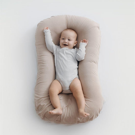 Baby Nest Bed Crib Newborn Baby Nest Cot Cribs Infant Portable Cotton Crib Travel Cradle Cushion $111.28 Dana Fashion Color: Beige Size: 45x75cm Baby & Mother Overview: Portable and washable Suitable for various sleeping positions of the baby Simulate the