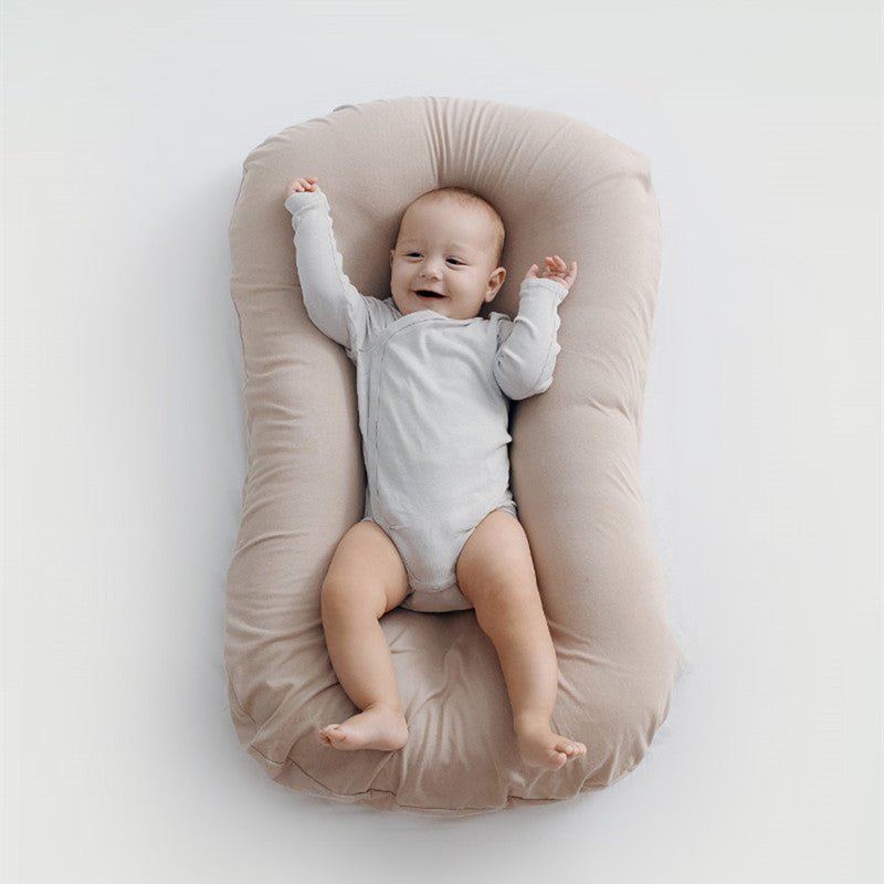 Baby Nest Bed Crib Newborn Baby Nest Cot Cribs Infant Portable Cotton Crib Travel Cradle Cushion $111.28 Dana Fashion Color: Beige Size: 45x75cm Baby & Mother Overview: Portable and washable Suitable for various sleeping positions of the baby Simulate the