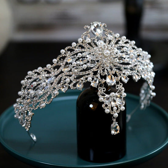 Baroque Bride Crown Fashion Headwear $35.00 Dana Fashion Color: Silver Women's Accessories Product information: Material: Alloy Style: Crown Treatment process: electroplating Color: Silver+Dotted Pearl+Quota Decoration Size: diameter 15CM, height approxim