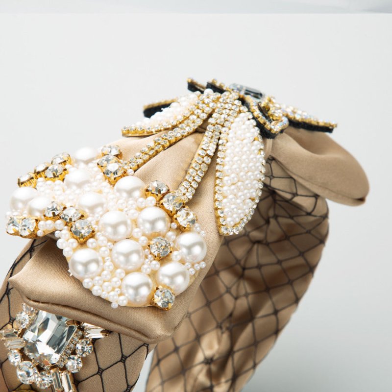 Baroque Fabric Bow Full Diamond Pearl Headband $69.50 Dana Fashion Color: Coffee Women's Accessories Product information: Color: gray, coffee, pink Applicable people: women Material: Rhinestone Popular elements: Bow Style: affordable luxury style Packing