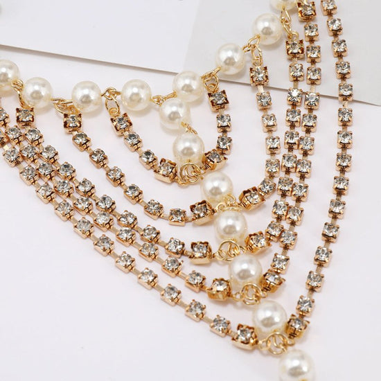 Beach Foot Ornaments Fashion Luxury Multi-layer Diamond Claw Chain Pearl Tassel $50.00 Dana Fashion Color: Gold Women's Accessories Product information: Color: gold, silver Style: Women's Material: Alloy Shape: heart shape Style: European and American Pac