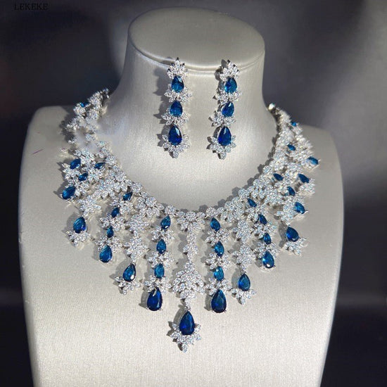 Blue Full Rhinestone Zircon Tassel Necklace Earring Bracelet Four-piece Set $350.50 Dana Fashion Color: Blue Women's Accessories Product information: Material: zircon/Rhinestone Product Type: Ornament Color classification: blue necklace earring bracelet r