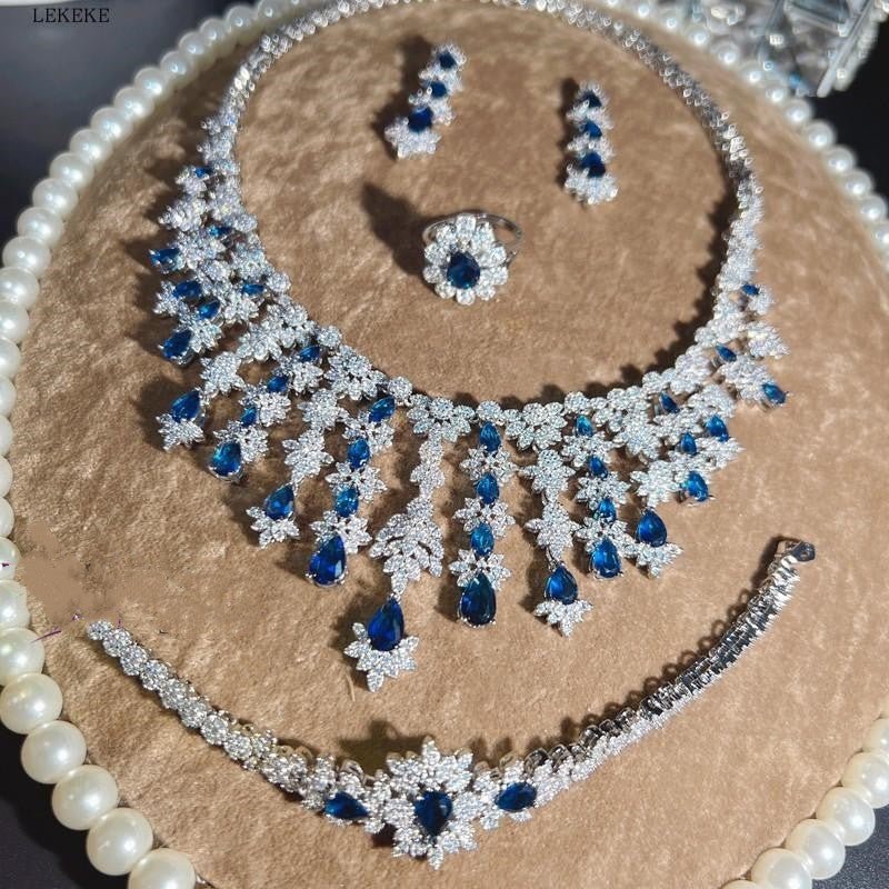 Blue Full Rhinestone Zircon Tassel Necklace Earring Bracelet Four-piece Set $350.50 Dana Fashion Color: Blue Women's Accessories Product information: Material: zircon/Rhinestone Product Type: Ornament Color classification: blue necklace earring bracelet r
