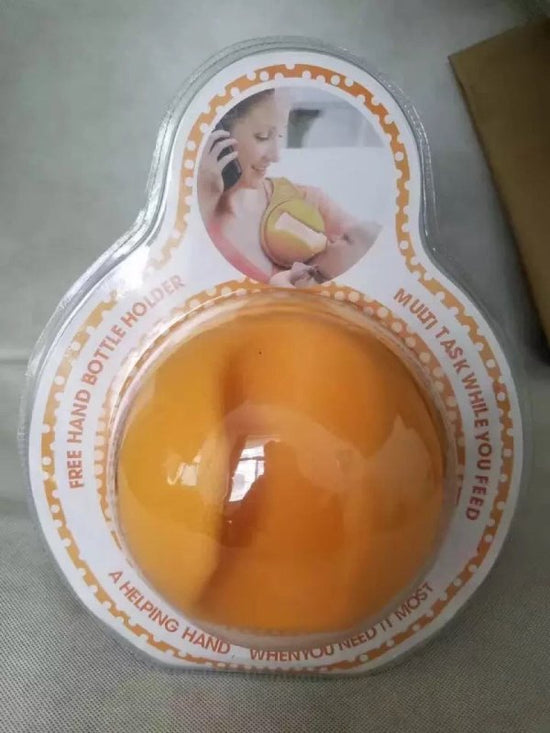 Bottle Holder The Hands Free Way To Feed Your Baby $39.93 Dana Fashion default: default Baby & Mother Features: Easy to use and easy to clean Rolls up neatly for easy storage or transport Lightweight, even with a full bottle Soft and flexible for a secure