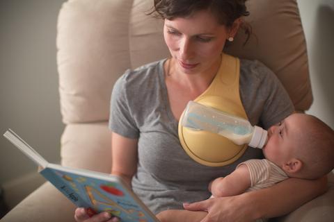 Bottle Holder The Hands Free Way To Feed Your Baby $39.93 Dana Fashion default: default Baby & Mother Features: Easy to use and easy to clean Rolls up neatly for easy storage or transport Lightweight, even with a full bottle Soft and flexible for a secure