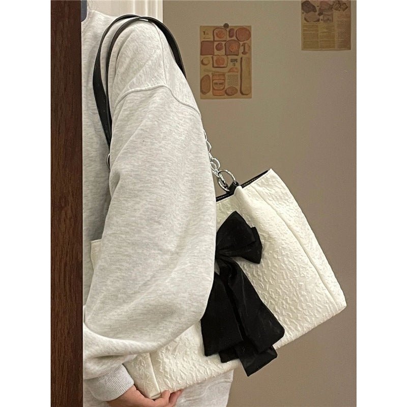 Bow Tote Large Capacity Canvas Shoulder Bag $29.77 Dana Fashion Color: White Women's Bags Product information: Lining texture: canvas Color: White Hardness: soft Material: Polyester Number of shoulder straps: Single Size: length 34, height 24, width 10CM