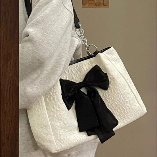 Bow Tote Large Capacity Canvas Shoulder Bag $29.77 Dana Fashion Color: White Women's Bags Product information: Lining texture: canvas Color: White Hardness: soft Material: Polyester Number of shoulder straps: Single Size: length 34, height 24, width 10CM