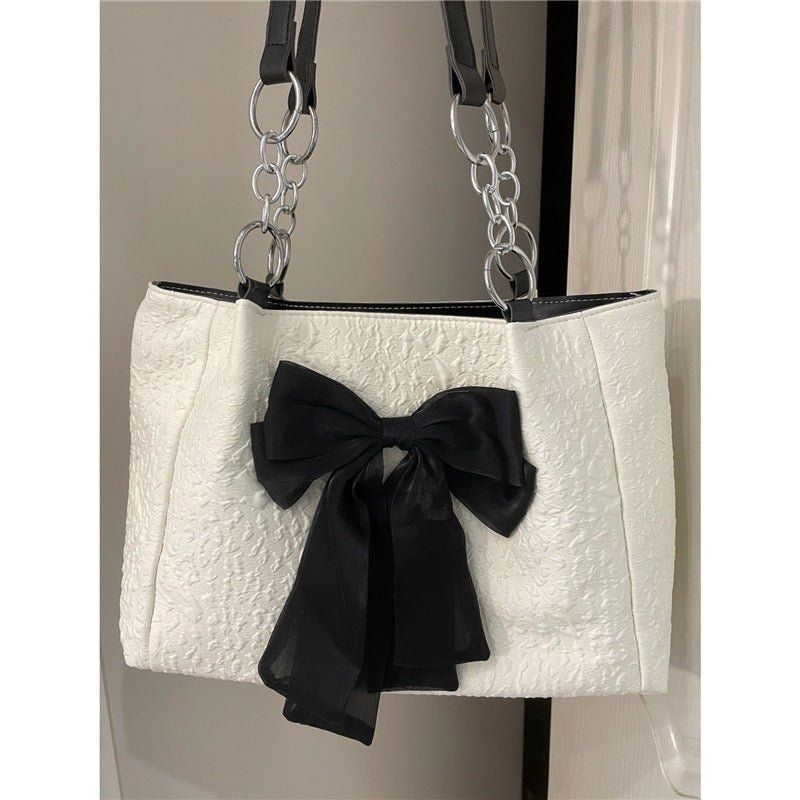 Bow Tote Large Capacity Canvas Shoulder Bag $29.77 Dana Fashion Color: White Women's Bags Product information: Lining texture: canvas Color: White Hardness: soft Material: Polyester Number of shoulder straps: Single Size: length 34, height 24, width 10CM