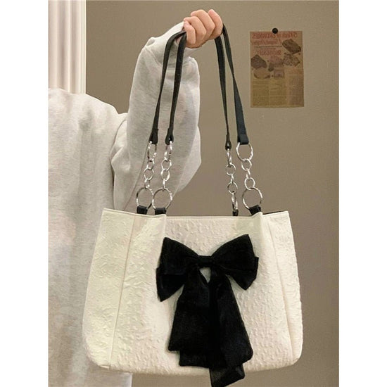 Bow Tote Large Capacity Canvas Shoulder Bag $29.77 Dana Fashion Color: White Women's Bags Product information: Lining texture: canvas Color: White Hardness: soft Material: Polyester Number of shoulder straps: Single Size: length 34, height 24, width 10CM