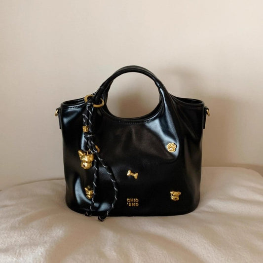 Bread Puppy Tote Bag Women's Portable Shoulder Messenger Bag $74.86 Dana Fashion Color: Black Baby & Mother Product information: Lining texture: Polyester Color: Black Hardness: medium and soft Material: PU Suitcase shape: square vertical model Number of