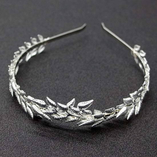 Bridal Golden Leaf Headband Alloy Crown Hair Accessories $15.00 Dana Fashion Color: Silver Women's Accessories Product information: Color: Gold non-diamond type, Silver non-diamond type Material: iron sheet Product size: 12 * 15cm Packing list: 1* Headban