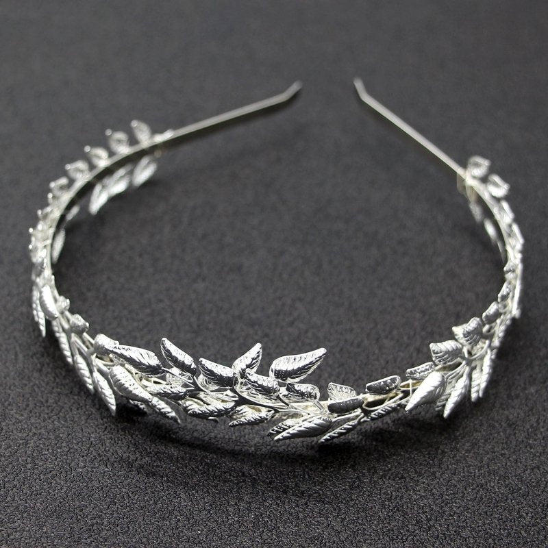 Bridal Golden Leaf Headband Alloy Crown Hair Accessories $15.00 Dana Fashion Color: Silver Women's Accessories Product information: Color: Gold non-diamond type, Silver non-diamond type Material: iron sheet Product size: 12 * 15cm Packing list: 1* Headban