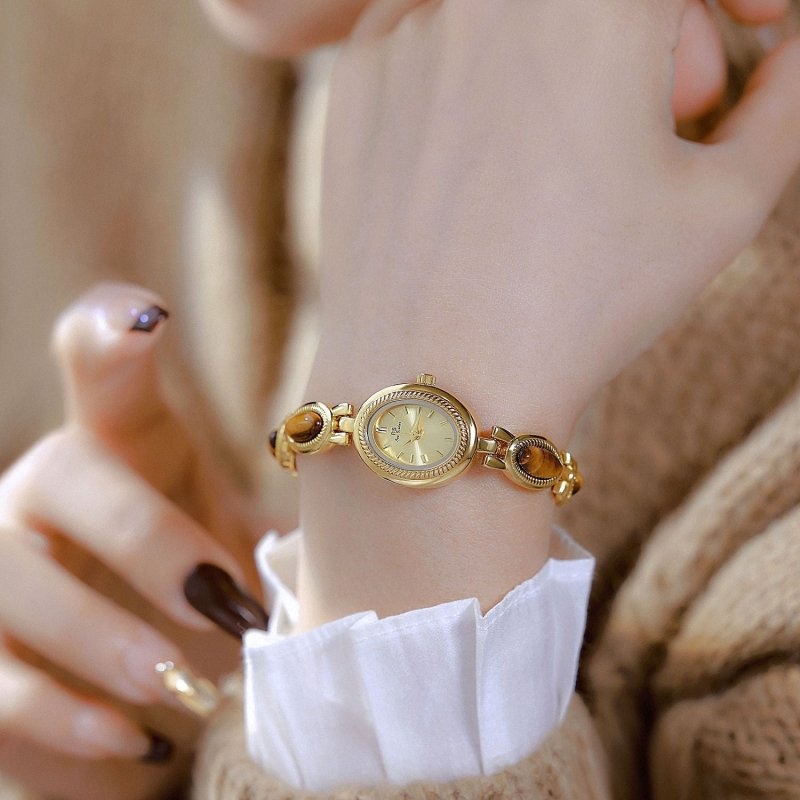 BS Gold Retro Rich Tigereye Chain Watch $25.00 Dana Fashion Color: Tiger Eye Champagne Gold Women's Accessories Product information: Color: Tiger Eye gold white, tiger eye champagne gold Thickness: 7mm Movement type: Quartz Dial diameter: 20*24 Crown type