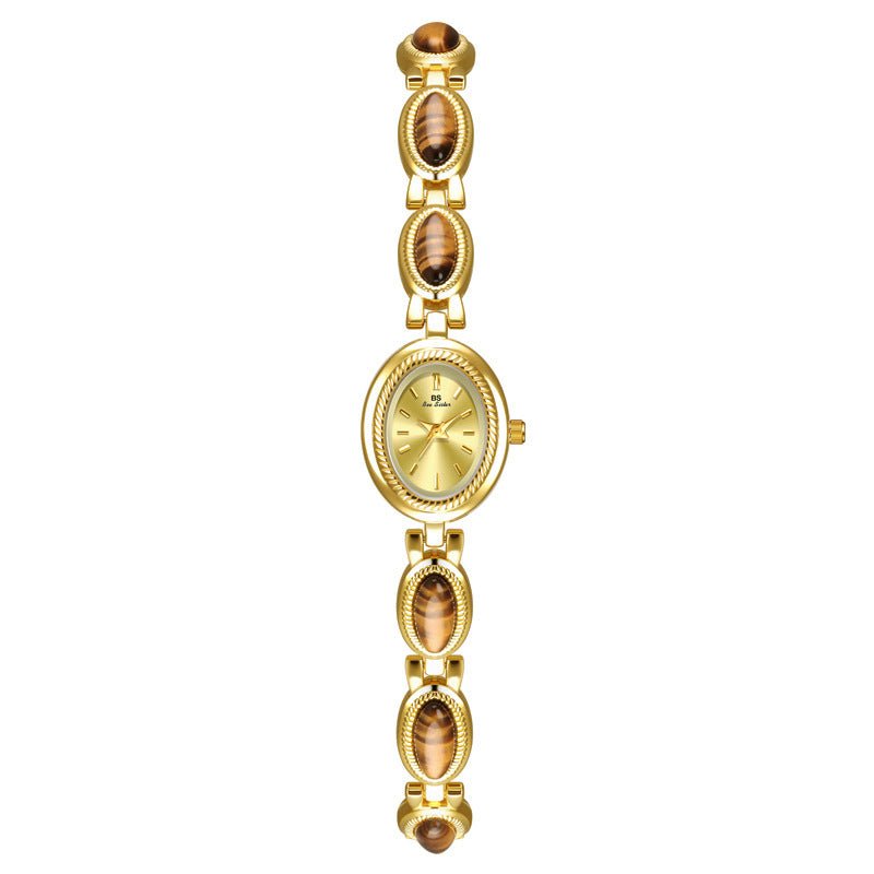BS Gold Retro Rich Tigereye Chain Watch $25.00 Dana Fashion Color: Tiger Eye Champagne Gold Women's Accessories Product information: Color: Tiger Eye gold white, tiger eye champagne gold Thickness: 7mm Movement type: Quartz Dial diameter: 20*24 Crown type