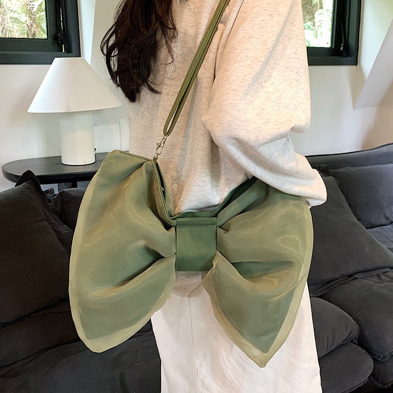 Butterfly Knot Personalized Shoulder Crossbody Bag $35.00 Dana Fashion Color: Black Size: No Specifications Women's Bags Product information: Lining texture: Polyester Applicable scenario: leisure travel Color: black, white, green Hardness: soft Size: no