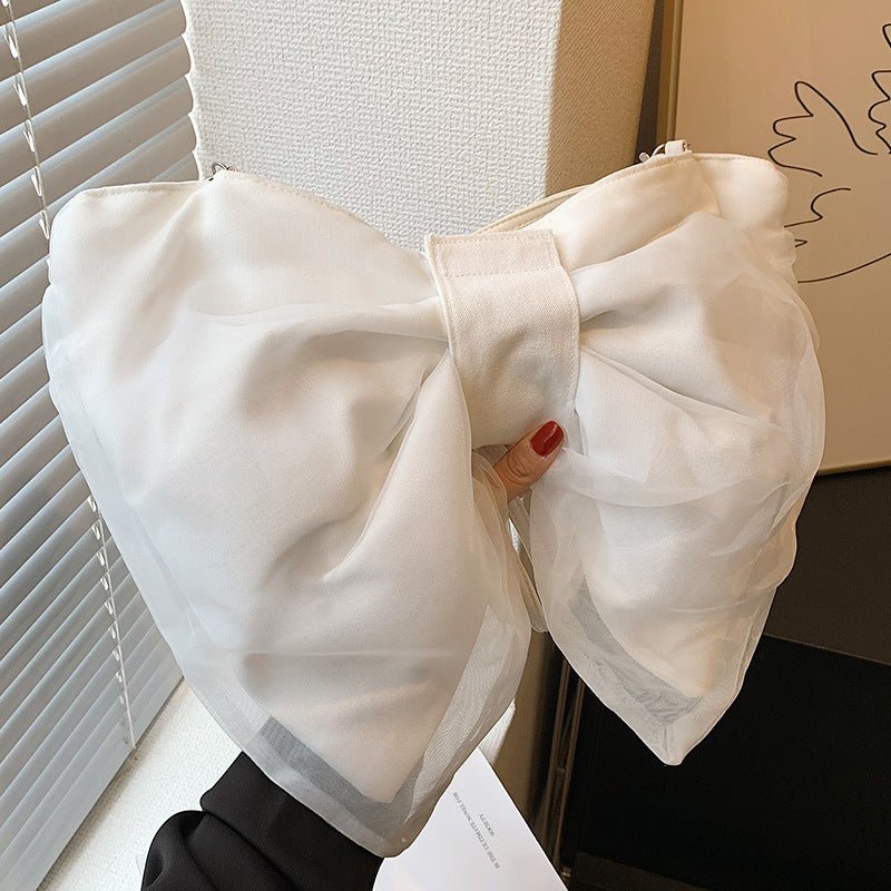 Butterfly Knot Personalized Shoulder Crossbody Bag $35.00 Dana Fashion Color: White Size: No Specifications Women's Bags Product information: Lining texture: Polyester Applicable scenario: leisure travel Color: black, white, green Hardness: soft Size: no