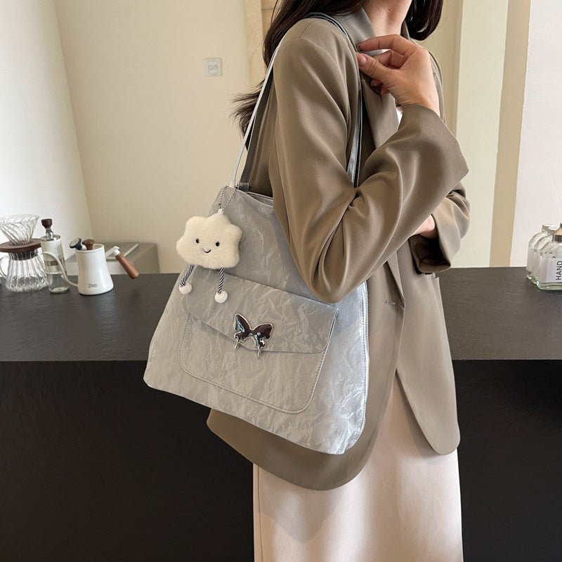 Cartoon Casual Solid Color Leather Shoulder Bag $29.31 Dana Fashion Color: Beige Size: With Pendant Women's Bags Product information: Lining texture: synthetic leather Color: black, cream white, blue, silver, pink Outer bag type: Pocket Sandwich Hardness: