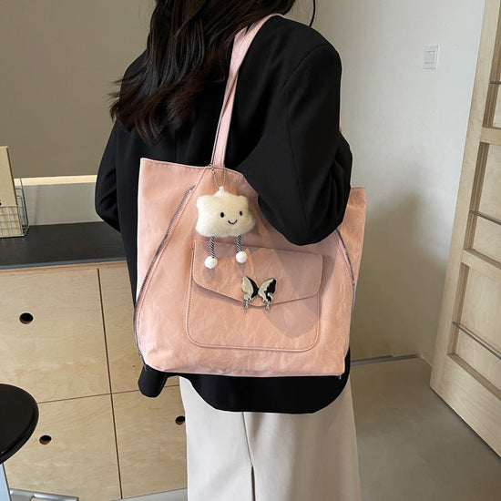 Cartoon Casual Solid Color Leather Shoulder Bag $29.31 Dana Fashion Color: Beige Size: With Pendant Women's Bags Product information: Lining texture: synthetic leather Color: black, cream white, blue, silver, pink Outer bag type: Pocket Sandwich Hardness: