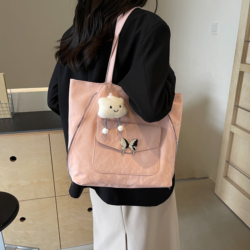 Cartoon Casual Solid Color Leather Shoulder Bag $29.31 Dana Fashion Color: Beige Size: With Pendant Women's Bags Product information: Lining texture: synthetic leather Color: black, cream white, blue, silver, pink Outer bag type: Pocket Sandwich Hardness: