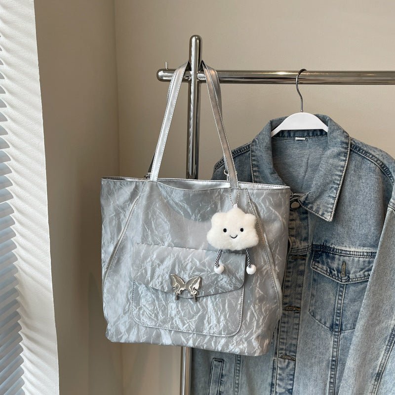Cartoon Casual Solid Color Leather Shoulder Bag $29.31 Dana Fashion Color: Silver Size: With Pendant Women's Bags Product information: Lining texture: synthetic leather Color: black, cream white, blue, silver, pink Outer bag type: Pocket Sandwich Hardness