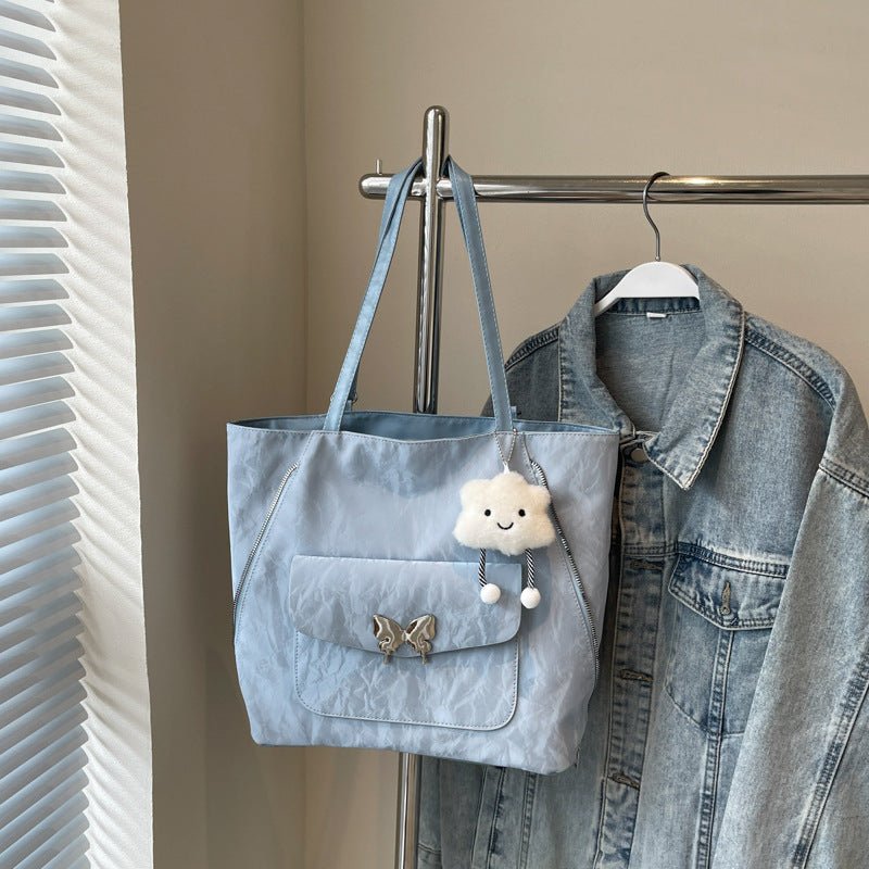 Cartoon Casual Solid Color Leather Shoulder Bag $29.31 Dana Fashion Color: Blue Size: With Pendant Women's Bags Product information: Lining texture: synthetic leather Color: black, cream white, blue, silver, pink Outer bag type: Pocket Sandwich Hardness:
