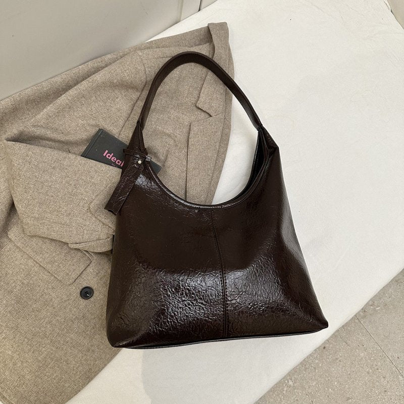 Casual Simple Easy Matching Tote Bag $43.50 Dana Fashion Color: Brown Women's Bags Product information: Lining texture: Polyester Color: black, brown, red, brown Material: PU Package internal structure: mobile phone bag Popular elements: sewing thread Siz