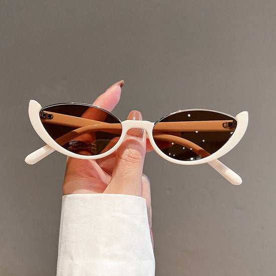 Cat Eye Sunglasses Women European And American Fashion Trending $15.52 Dana Fashion Color: Beige Frame Dried Women's Accessories Product information: Applicable scenarios: sun protection, fashion wear, stage performance, party gathering Color: Black Frame