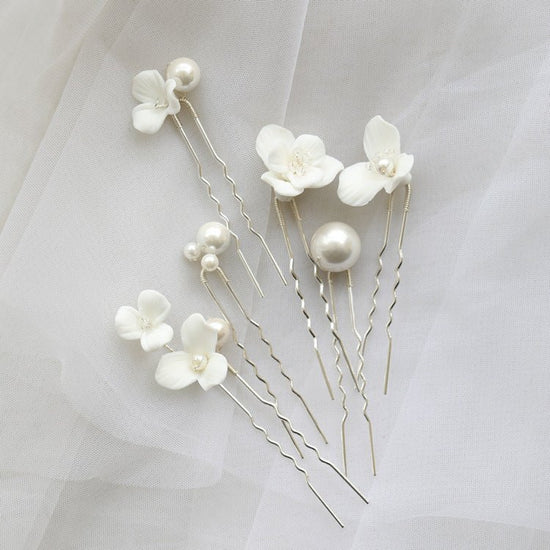 Ceramic Flower Pearl Embellished Bridal Hairpin Hair Plug Simple Hair Accessories $18.50 Dana Fashion Color: Silver Sets Women's Accessories Product information: Style: Women's Color: gold one set, silver one set, gold earrings one pair (auricular needle,