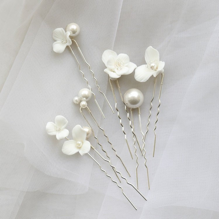 Ceramic Flower Pearl Embellished Bridal Hairpin Hair Plug Simple Hair Accessories $18.50 Dana Fashion Color: Silver Sets Women's Accessories Product information: Style: Women's Color: gold one set, silver one set, gold earrings one pair (auricular needle,